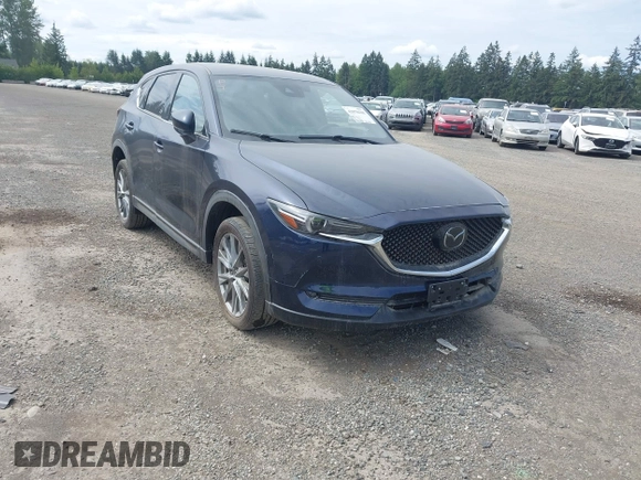 2019 Mazda CX-5 Signature with VIN JM3KFBEY7K0589236, listed as a IAAI auction lot 42078418 with 86,959 mi miles. Bid and sale history available at carsss.com. Image 1.