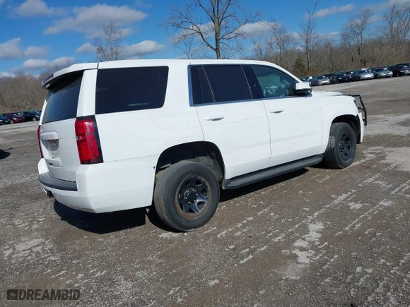 2020 Chevrolet Tahoe Commercial with VIN 1GNSKDEC2LR217697, listed as a IAAI auction lot 40815499 with 128,503 mi miles. Bid and sale history available at carsss.com. Image 4.
