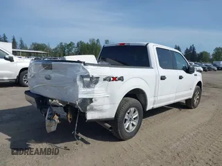 2015 Ford F-150 XLT with VIN 1FTEW1EP4FKE54734, listed as a IAAI auction lot 42137158 with 153,991 mi miles. Bid and sale history available at carsss.com. Image 4.
