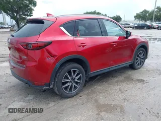 2018 Mazda CX-5 Grand Touring with VIN JM3KFADM5J0437365, listed as a IAAI auction lot 42657919 with 96,760 mi miles and . Bid and sale history available at DreamBid. Image 4.