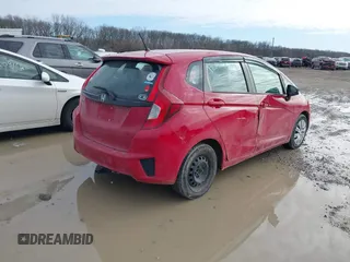 2015 Honda Fit LX z VIN 3HGGK5H54FM728448, wystawiony jako IAAI lot #41538650 z przebiegiem 115 450 mil mil oraz . Historia ofert i sprzedaży dostępna na DreamBid. Obrazek 4.