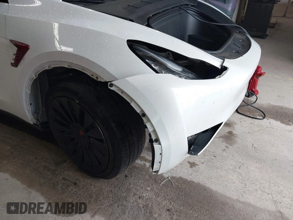 2023 Tesla Model Y Long Range with VIN 7SAYGDEE7PA100523, listed as a IAAI auction lot 40399455 with 18,885 mi miles and . Bid and sale history available at DreamBid. Image 6.