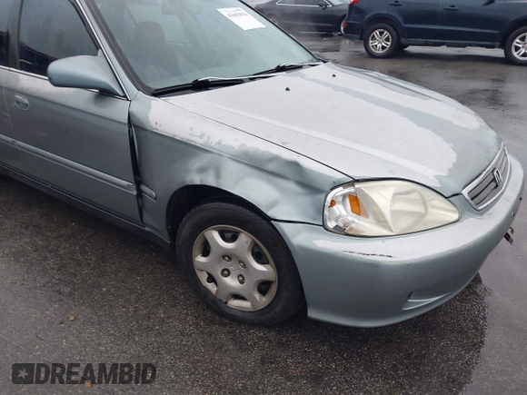 1999 Honda Civic EX z VIN 1HGEJ8643XL010821, wystawiony jako IAAI lot #41602036 z przebiegiem 165 139 mil mil oraz . Historia ofert i sprzedaży dostępna na DreamBid. Obrazek 6.