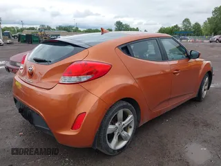 2012 Hyundai Veloster w/Gray Int with VIN KMHTC6AD3CU057620, listed as a IAAI auction lot 42320549 with 113,491 mi miles and . Bid and sale history available at DreamBid. Image 4.