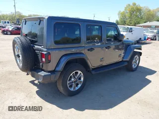 2018 Jeep Wrangler Unlimited Sahara with VIN 1C4HJXEG0JW166645, listed as a IAAI auction lot 42228492 with 58,416 mi miles and . Bid and sale history available at DreamBid. Image 4.