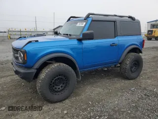 2023 Ford Bronco with VIN 1FMDE5AHXPLB26651, listed as a Copart auction lot 77497964 with 19,700 mi miles and Salvage Title. Bid and sale history available at carsss.com. Image 1.