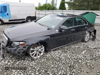 2018 Mercedes-Benz E 300 with VIN WDDZF4KB6JA302552, listed as a Copart auction lot 61095395 with 76,425 mi miles and Salvage title. Bid and sale history available at DreamBid. Image 1.
