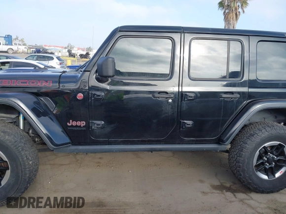 2020 Jeep Wrangler Unlimited Rubicon with VIN 1C4HJXFG1LW141335, listed as a IAAI auction lot 42724973 with 59,843 mi miles and . Bid and sale history available at DreamBid. Image 14.