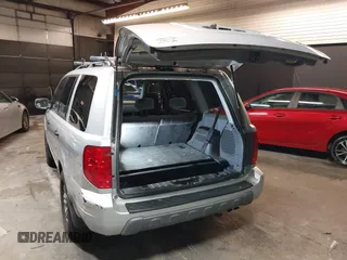 2005 Honda Pilot EX with VIN 5FNYF18465B031034, listed as a IAAI auction lot 41925858 with 194,211 mi miles and . Bid and sale history available at DreamBid. Image 3.
