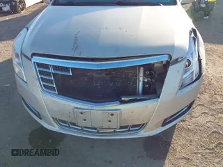 2014 Cadillac XTS with VIN 2G61L5S30E9207777, listed as a IAAI auction lot 41202654 with 112,565 mi miles. Bid and sale history available at carsss.com. Image 6.