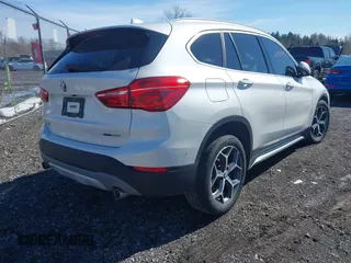 2019 BMW X1 xDrive28i with VIN WBXHT3C58K5N05523, listed as a IAAI auction lot 41752675 with 63,861 mi miles. Bid and sale history available at carsss.com. Image 4.