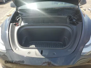 2023 Tesla Model Y Long Range z VIN 7SAYGDEE9PA115279, wystawiony jako Copart lot #55018275 z przebiegiem 43 026 mil mil oraz Szkoda całkowita • Salvage title. Historia ofert i sprzedaży dostępna na DreamBid. Obrazek 11.