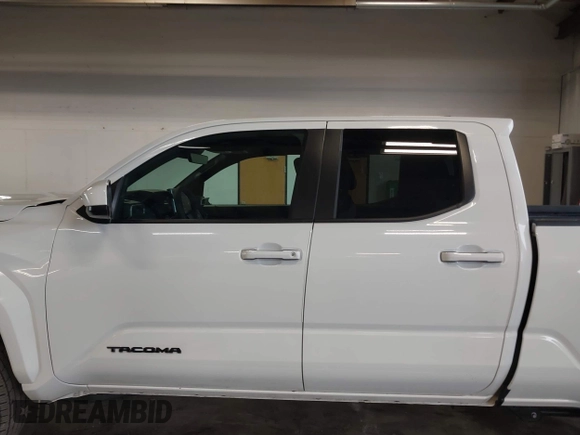 2025 Toyota Tacoma SR with VIN 3TMLB5JN2SM090394, listed as a IAAI auction lot 41916312 with 840 mi miles and . Bid and sale history available at DreamBid. Image 15.