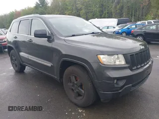 2011 Jeep Grand Cherokee Laredo with VIN 1J4RR4GGXBC604304, listed as a IAAI auction lot 42201742 with 196,483 mi miles. Bid and sale history available at carsss.com. Image 1.