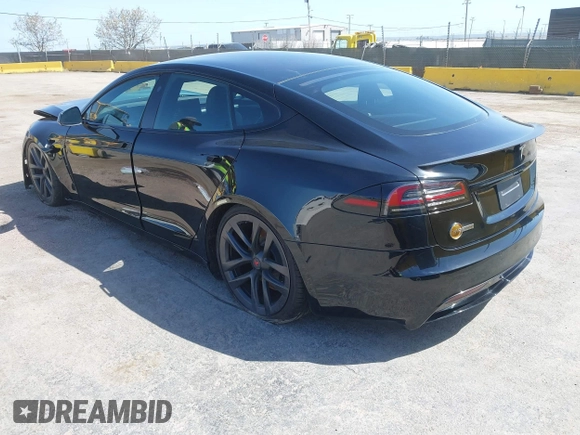 2022 Tesla Model S Plaid with VIN 5YJSA1E61NF483354, listed as a IAAI auction lot 41973636 with 32,541 mi miles and . Bid and sale history available at DreamBid. Image 3.