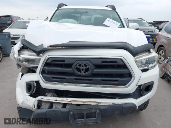 2016 Toyota Tacoma SR5 z VIN 5TFAZ5CN5GX018977, wystawiony jako IAAI lot #42303122 z przebiegiem 99 545 mil mil oraz . Historia ofert i sprzedaży dostępna na DreamBid. Obrazek 12.