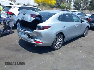 2020 Mazda 3 Select with VIN 3MZBPACL1LM131999, listed as a IAAI auction lot 42433532 with 23,067 mi miles and . Bid and sale history available at DreamBid. Image 4.