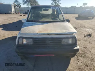 1990 Geo Tracker z VIN 2CNBJ18UXL6217744, wystawiony jako Copart lot #84203244 z przebiegiem 23 221 mil mil oraz Szkody całkowita. Historia ofert i sprzedaży dostępna na DreamBid. Obrazek 5.