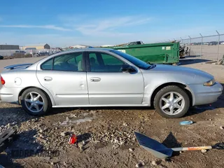 2004 Oldsmobile Alero GL1 z VIN 1G3NL52E94C189058, wystawiony jako IAAI lot #41224615 z przebiegiem 208 921 mil mil oraz . Historia ofert i sprzedaży dostępna na DreamBid. Obrazek 13.