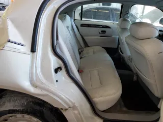 1999 Lincoln Town Car Executive with VIN 1LNHM81W2XY658371, listed as a Copart auction lot 60249045 with 191,266 mi miles and Salvage title. Bid and sale history available at DreamBid. Image 10.