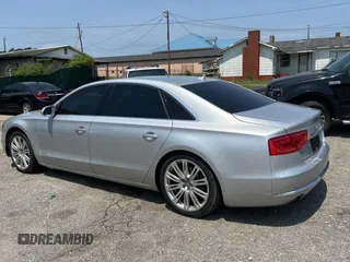 2013 Audi A8 3.0L with VIN WAURGAFD6DN010072, listed as a Copart auction lot 57999295 with 116,555 mi miles and Salvage title. Bid and sale history available at DreamBid. Image 3.