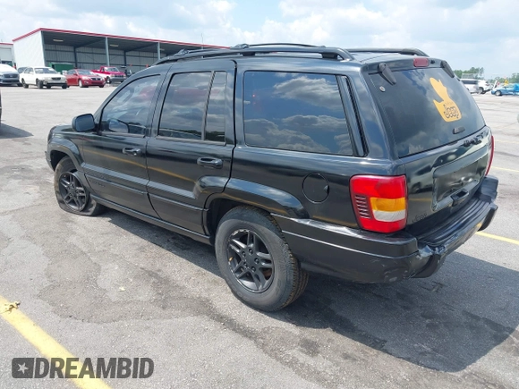 2002 Jeep Grand Cherokee Laredo with VIN 1J4GX48S42C313801, listed as a IAAI auction lot 42297223 with 153,633 mi miles and . Bid and sale history available at DreamBid. Image 3.