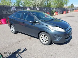 2011 Ford Fiesta SE with VIN 3FADP4BJ7BM135864, listed as a IAAI auction lot 42134479 with 118,573 mi miles. Bid and sale history available at carsss.com. Image 1.