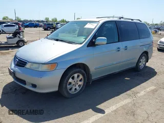 2003 Honda Odyssey EX with VIN 2HKRL18603H502236, listed as a IAAI auction lot 41929501 with 287,538 mi miles and . Bid and sale history available at DreamBid. Image 2.