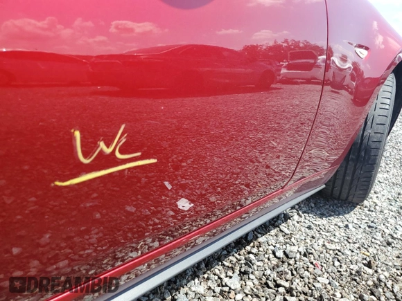 2020 Mazda MX-5 Miata Grand Touring z VIN JM1NDAD79L0415751, wystawiony jako Copart lot #71864574 z przebiegiem Nie podano mil oraz Szkoda całkowita • Salvage title. Historia ofert i sprzedaży dostępna na DreamBid. Obrazek 12.