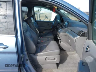 2008 Honda Odyssey Touring with VIN 5FNRL38868B047556, listed as a IAAI auction lot 41581617 with 220,436 mi miles. Bid and sale history available at carsss.com. Image 5.