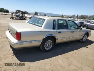 1997 Lincoln Town Car Executive with VIN 1LNLM81W8VY734974, listed as a Copart auction lot 61440195 with 94,982 mi miles and Clean title. Bid and sale history available at DreamBid. Image 3.