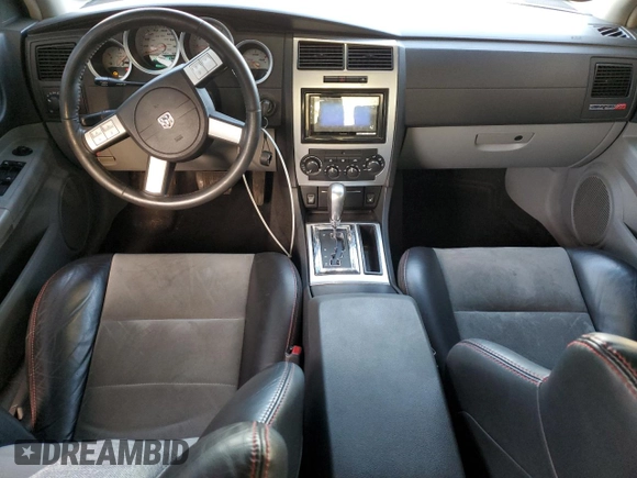 2006 Dodge Charger SRT-8 with VIN 2B3LA73W36H369475, listed as a Copart auction lot 43774705 with 130,495 mi miles and Salvage Title. Bid and sale history available at DreamBid. Image 8.