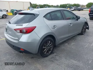 2014 Mazda 3 i Grand Touring with VIN JM1BM1M73E1216596, listed as a IAAI auction lot 41621165 with 127,235 mi miles and . Bid and sale history available at DreamBid. Image 4.