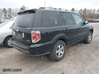 2007 Honda Pilot EX-L with VIN 2HKYF18517H513293, listed as a IAAI auction lot 41957031 with 264,875 mi miles. Bid and sale history available at carsss.com. Image 4.