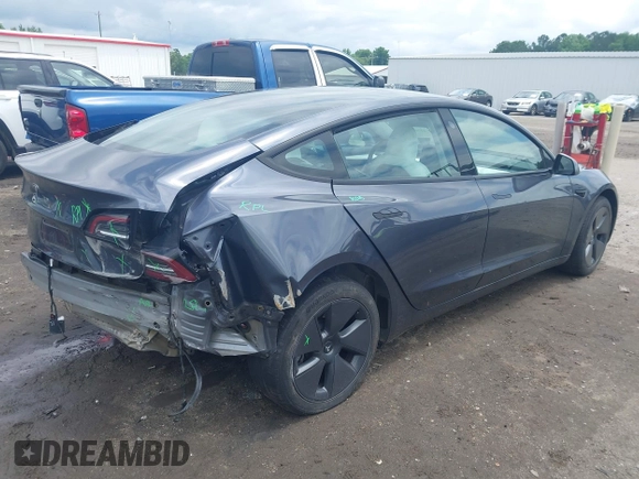 2023 Tesla Model 3 with VIN 5YJ3E1EAXPF628911, listed as a IAAI auction lot 42362410 with 25,387 mi miles and . Bid and sale history available at DreamBid. Image 4.
