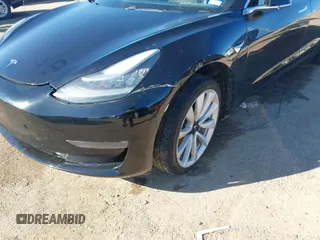2018 Tesla Model 3 Long Range Battery with VIN 5YJ3E1EA2JF014975, listed as a IAAI auction lot 41319407 with 106,301 mi miles and . Bid and sale history available at DreamBid. Image 6.