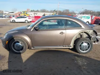 2012 Volkswagen Beetle 2.5L PZEV with VIN 3VWJP7AT9CM609099, listed as a IAAI auction lot 41396554 with 151,393 mi miles. Bid and sale history available at carsss.com. Image 14.