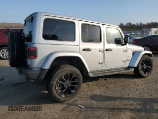 2024 Jeep Wrangler Sahara with VIN 1C4RJXP60RW128448, listed as a Copart auction lot 48658135 with 5,879 mi miles and Salvage Title. Bid and sale history available at DreamBid. Image 3.
