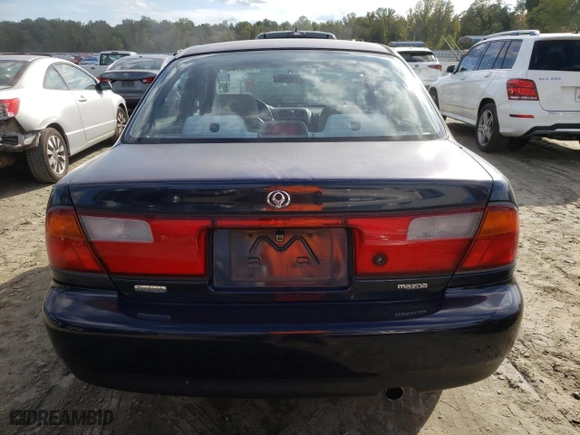 1997 Mazda Protege DX with VIN JM1BC1418V0171451, listed as a Copart auction lot 72309444 with 0 mi miles and Salvage Title. Bid and sale history available at carsss.com. Image 6.