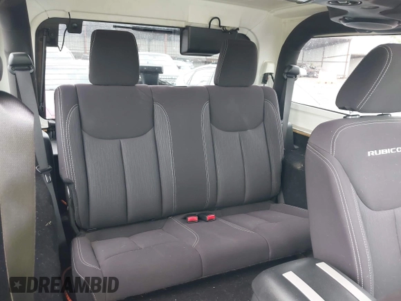 2014 Jeep Wrangler Rubicon with VIN 1C4BJWCG4EL145081, listed as a IAAI auction lot 42180723 with 113,659 mi miles and . Bid and sale history available at DreamBid. Image 8.