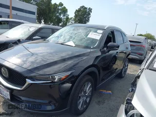 2020 Mazda CX-5 Grand Touring with VIN JM3KFADM3L1819939, listed as a IAAI auction lot 42749920 with 35,407 mi miles and . Bid and sale history available at DreamBid. Image 2.