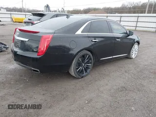 2014 Cadillac XTS Platinum with VIN 2G61W5S84E9291640, listed as a IAAI auction lot 41877867 with 100,462 mi miles and . Bid and sale history available at DreamBid. Image 4.