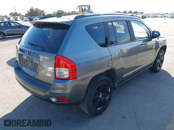 2011 Jeep Compass with VIN 1J4NT1FA0BD246586, listed as a IAAI auction lot 41253630 with 120,540 mi miles. Bid and sale history available at carsss.com. Image 4.