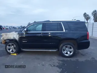 2015 Chevrolet Tahoe LTZ z VIN 1GNSKCKC5FR213209, wystawiony jako IAAI lot #41023368 z przebiegiem Nie podano mil oraz . Historia ofert i sprzedaży dostępna na DreamBid. Obrazek 13.