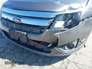 2012 Ford Fusion SE z VIN 3FAHP0HA8CR401382, wystawiony jako IAAI lot #41739680 z przebiegiem 73 404 mil mil oraz . Historia ofert i sprzedaży dostępna na DreamBid. Obrazek 6.