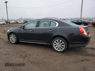 2015 Lincoln MKS with VIN 1LNHL9DK7FG606935, listed as a Copart auction lot 81991384 with 82,097 mi miles and Salvage Title. Bid and sale history available at carsss.com. Image 2.
