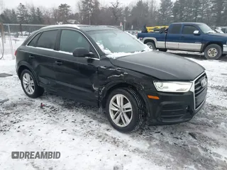 2017 Audi Q3 Premium Plus z VIN WA1JCCFS5HR000986, wystawiony jako IAAI lot #41471543 z przebiegiem 68 087 mil mil oraz . Historia ofert i sprzedaży dostępna na DreamBid. Obrazek 1.