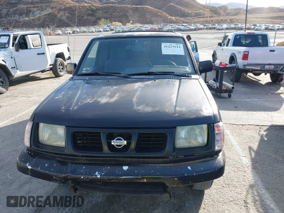 1999 Nissan Frontier XE z VIN 1N6DD26S6XC329964, wystawiony jako IAAI lot #41227011 z przebiegiem 199 039 mil mil oraz . Historia ofert i sprzedaży dostępna na DreamBid. Obrazek 13.