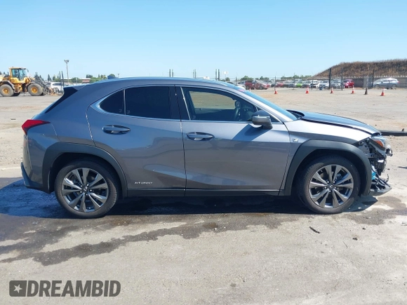 2021 Lexus UX 250h F Sport z VIN JTHR9JBH3M2052706, wystawiony jako IAAI lot #42321784 z przebiegiem 23 290 mil mil oraz . Historia ofert i sprzedaży dostępna na DreamBid. Obrazek 14.
