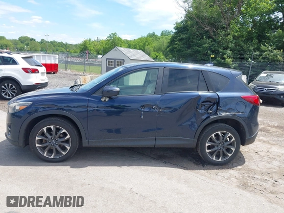 2016 Mazda CX-5 Grand Touring z VIN JM3KE4DY1G0817562, wystawiony jako IAAI lot #42289929 z przebiegiem 135 476 mil mil oraz . Historia ofert i sprzedaży dostępna na DreamBid. Obrazek 6.